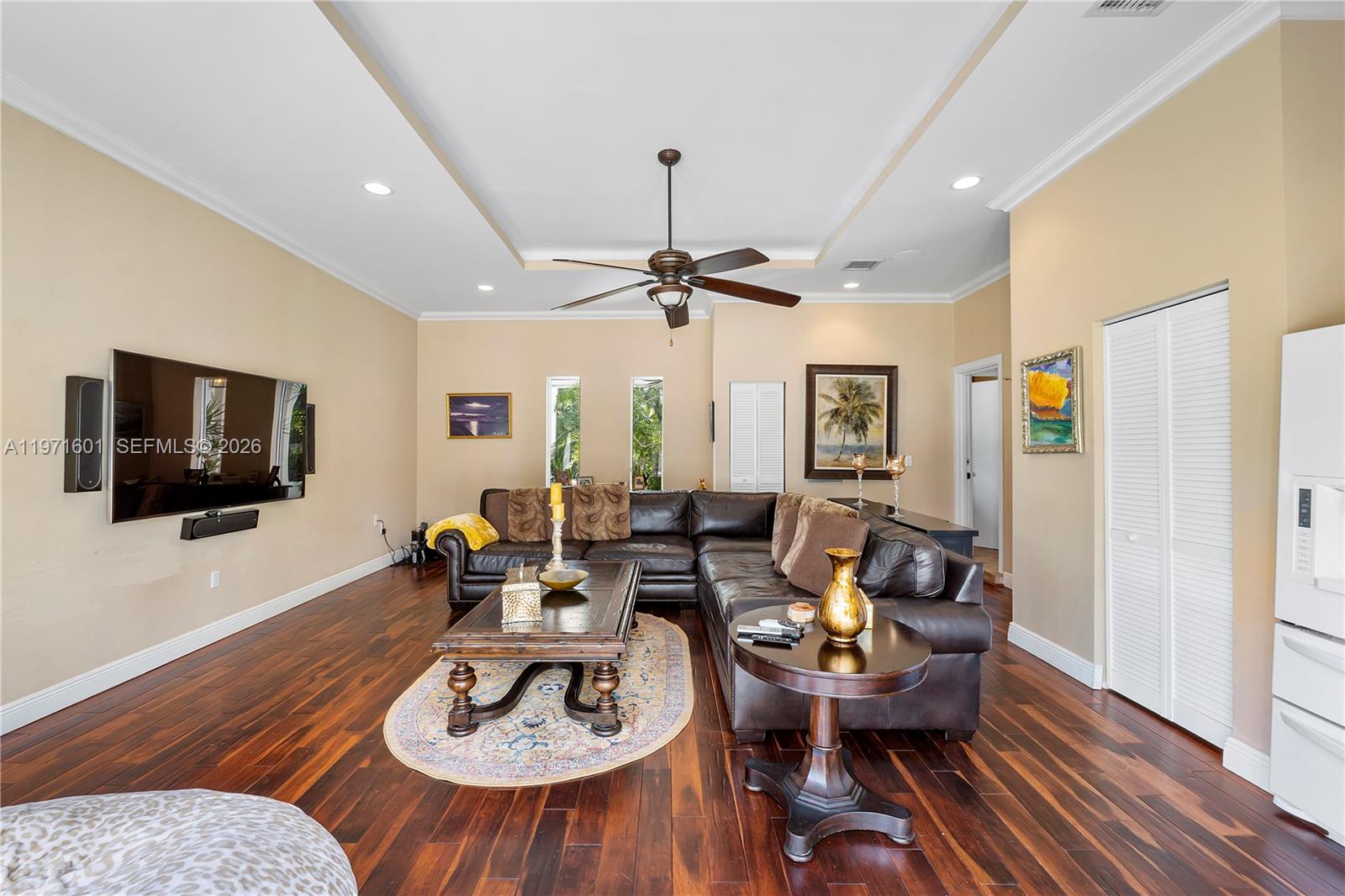 17640 Old Cutler Road Palmetto Bay, FL 33157 - Photo 38 of 56 a living room with furniture and a flat screen tv