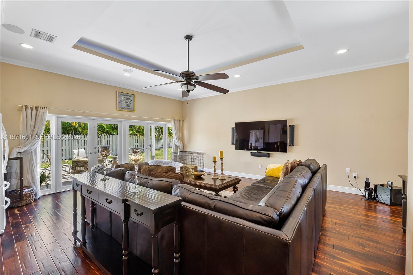 17640 Old Cutler Road Palmetto Bay, FL 33157 - Photo 39 of 56 a living room with furniture and a flat screen tv