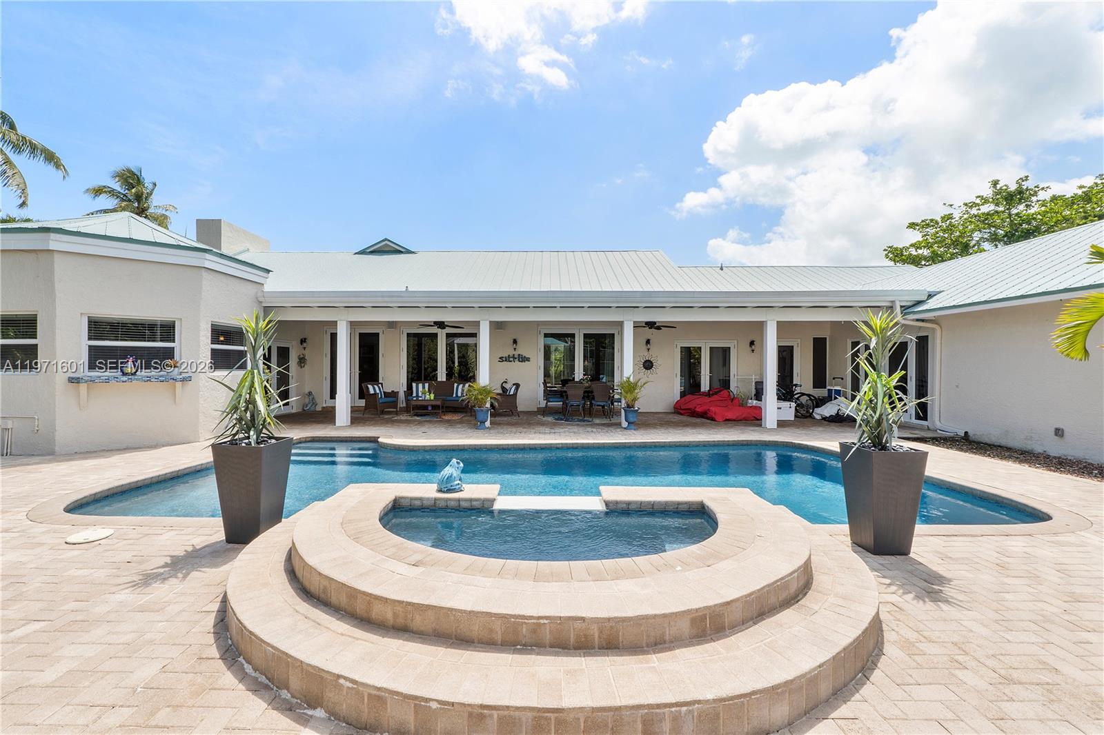 17640 Old Cutler Road Palmetto Bay, FL 33157 - Photo 40 of 56 a view of house with swimming pool and sitting area