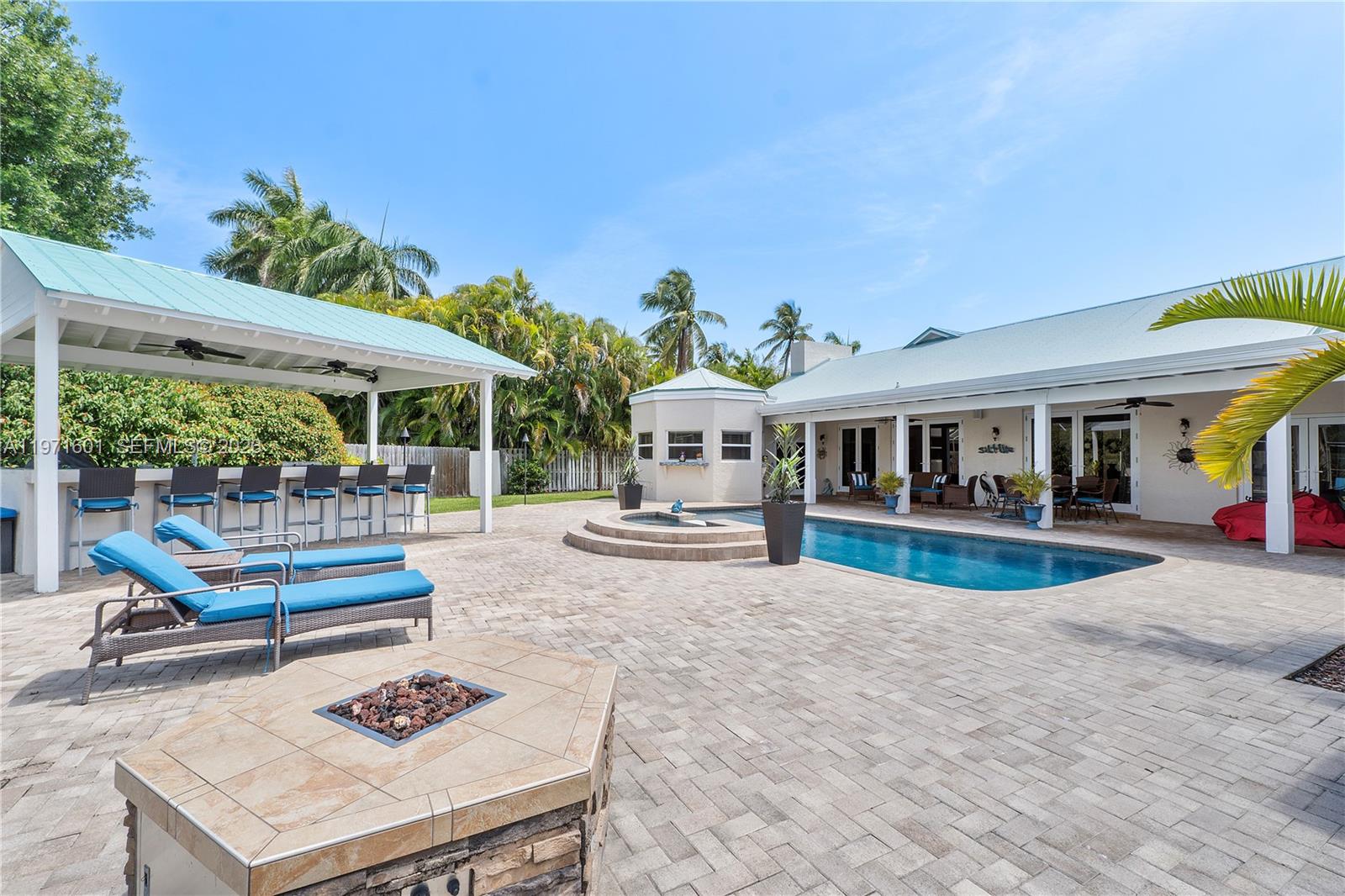17640 Old Cutler Road Palmetto Bay, FL 33157 - Photo 41 of 56 a view of a house with swimming pool and sitting area