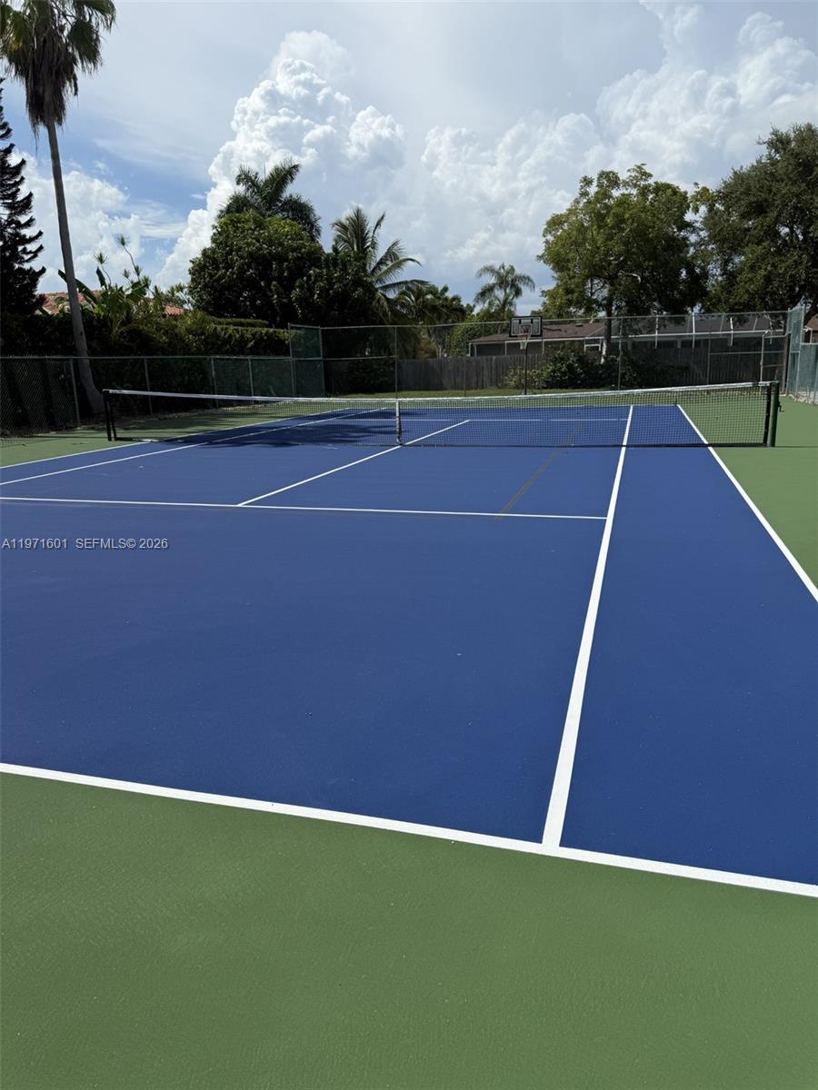 17640 Old Cutler Road Palmetto Bay, FL 33157 - Photo 48 of 56 a view of an outdoor space and tennis court