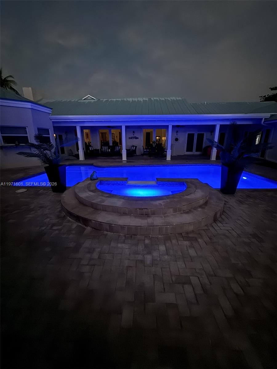 17640 Old Cutler Road Palmetto Bay, FL 33157 - Photo 55 of 56 a view of swimming pool with red brick wall