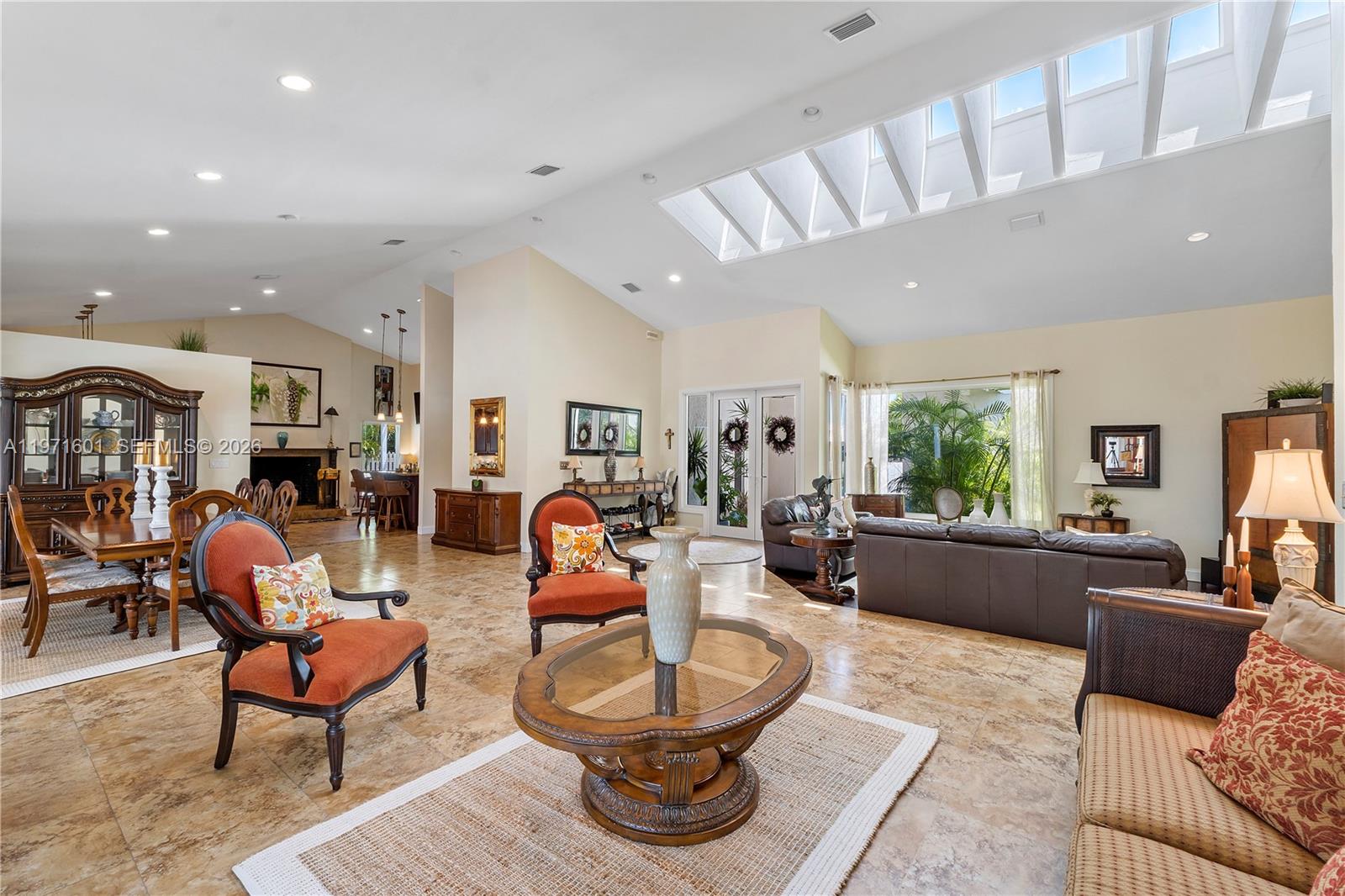 17640 Old Cutler Road Palmetto Bay, FL 33157 - Photo 7 of 56 a living room with furniture a rug and a large window