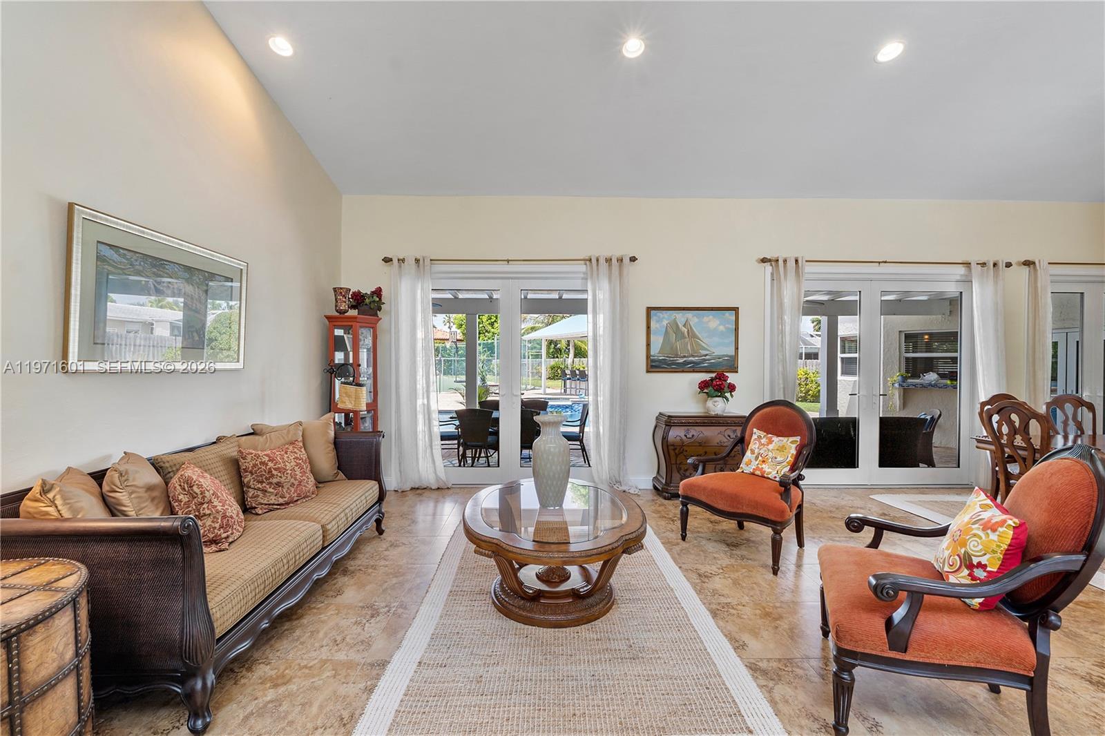 17640 Old Cutler Road Palmetto Bay, FL 33157 - Photo 8 of 56 a living room with furniture potted plant and large windows