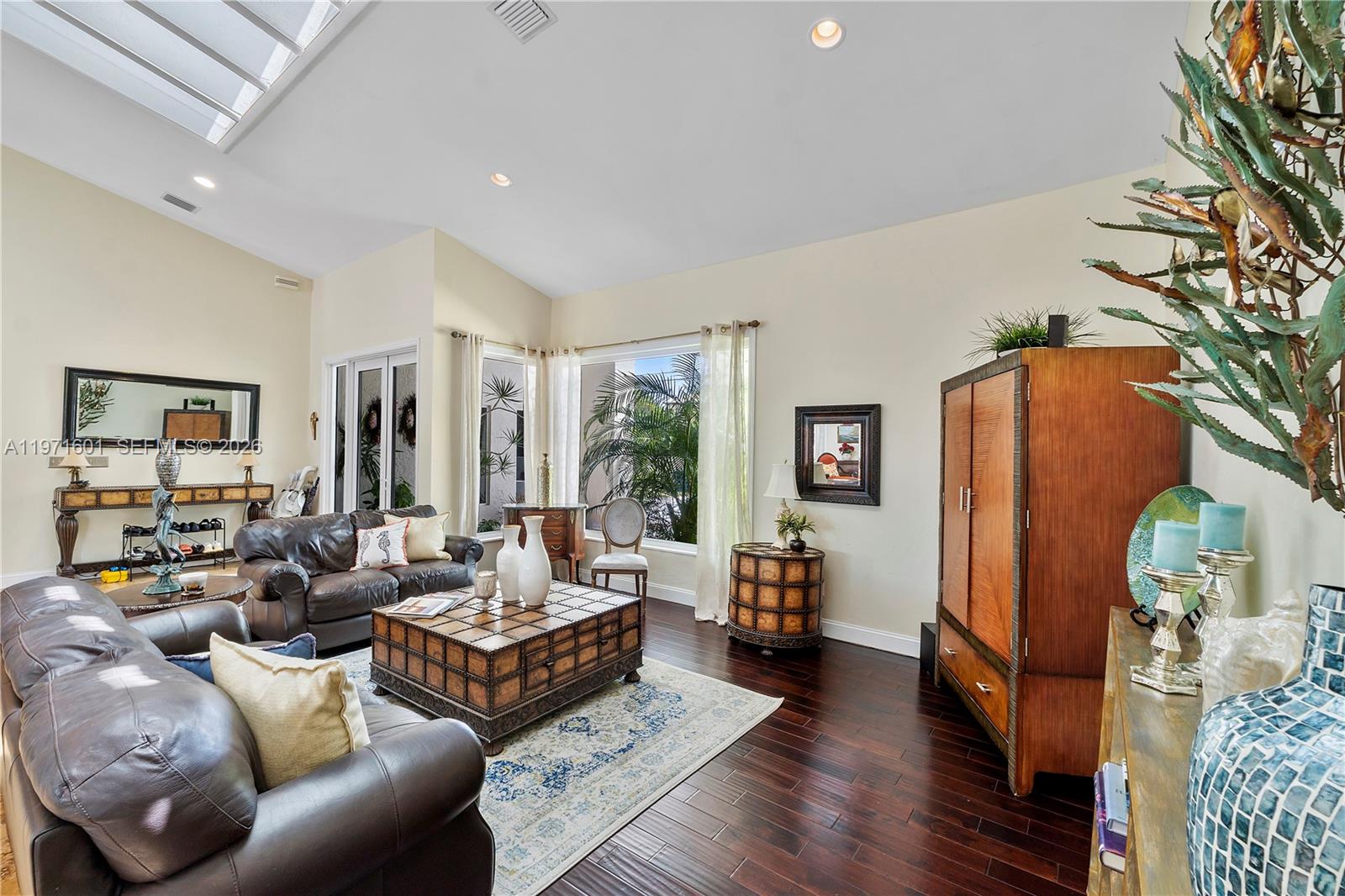 17640 Old Cutler Road Palmetto Bay, FL 33157 - Photo 9 of 56 a living room with furniture and a window