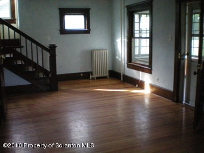 100 James Street Shavertown, PA 18708 - Photo 2 of 14 an empty room with wooden floor and windows