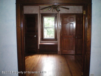 100 James Street Shavertown, PA 18708 - Photo 3 of 14 a view of empty room with wooden floor and fan