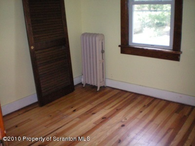 100 James Street Shavertown, PA 18708 - Photo 6 of 14 an empty room with wooden floor