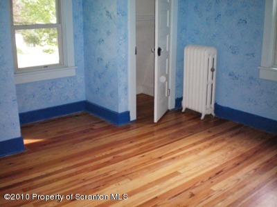 100 James Street Shavertown, PA 18708 - Photo 8 of 14 a view of empty room with wooden floor and fan