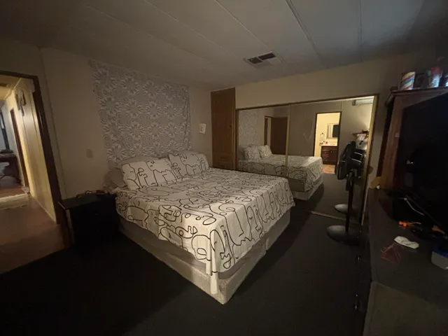 a room with a bed and furniture