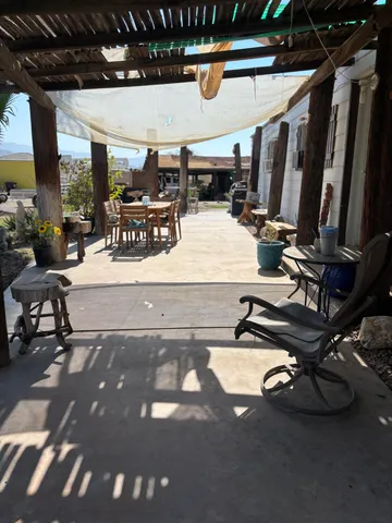 a view of a gym room with gym equipment