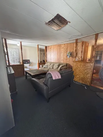 a bed sitting in a room next to a window