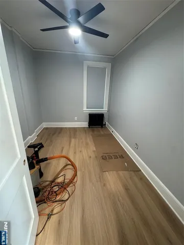 an empty room with wooden floor