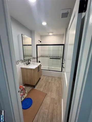 a bathroom with a sink toilet and mirror