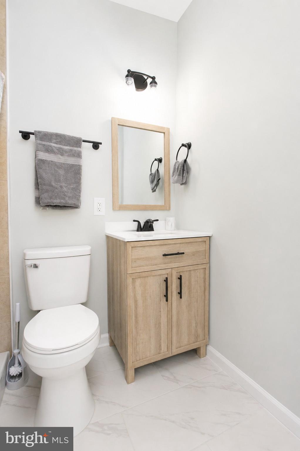 4319 Hadamar Road Spotsylvania, VA 22551 - Photo 23 of 24 a bathroom with a toilet a sink and mirror