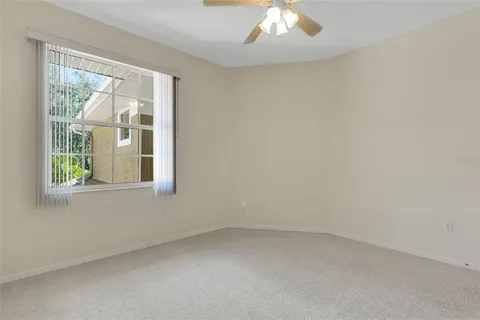 an aerial view of a house with outdoor space and lake view