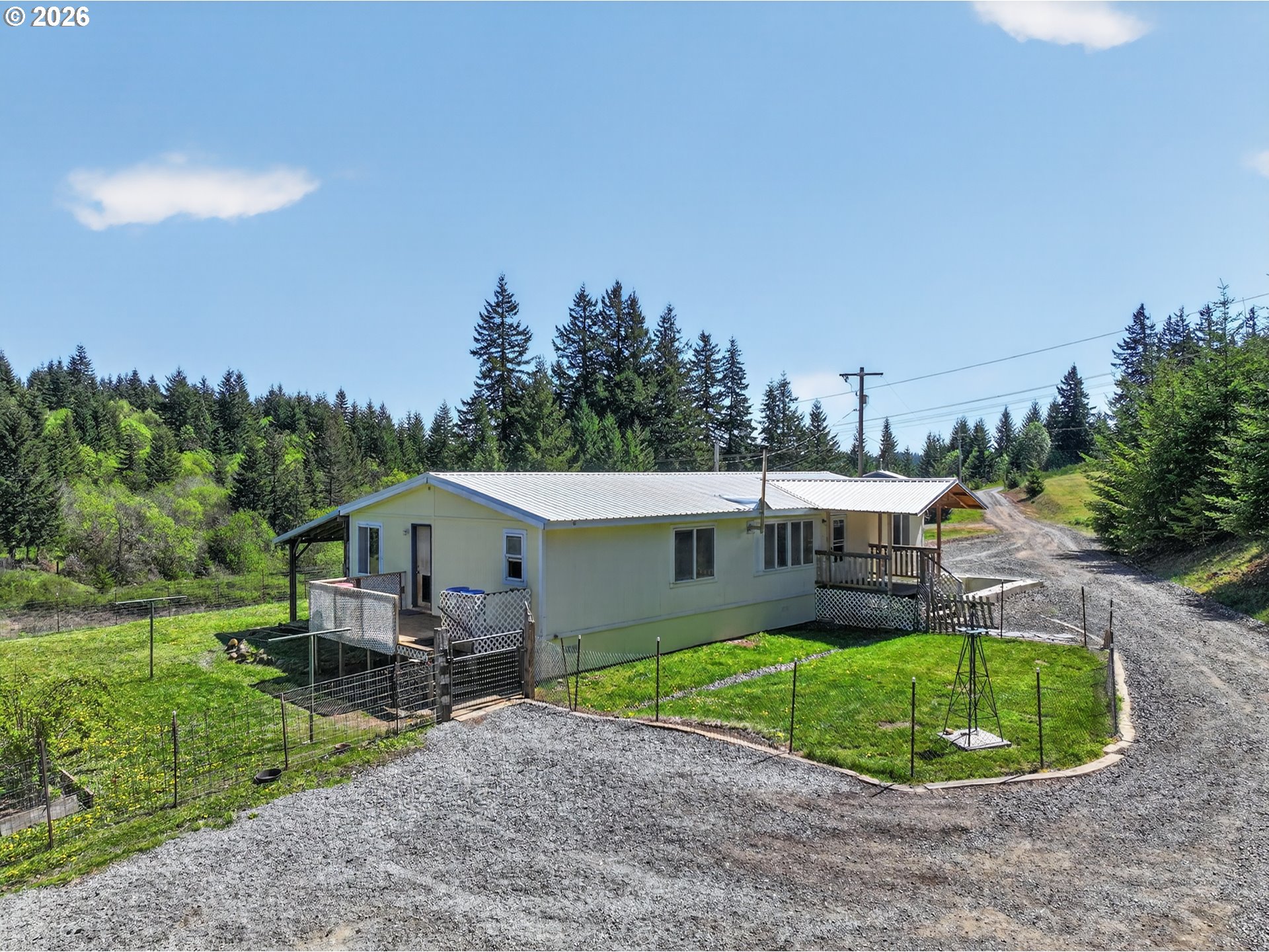 97 Kida Road White Salmon, WA 98672 - Photo 18 of 45 a aerial view of a house with a yard and trees