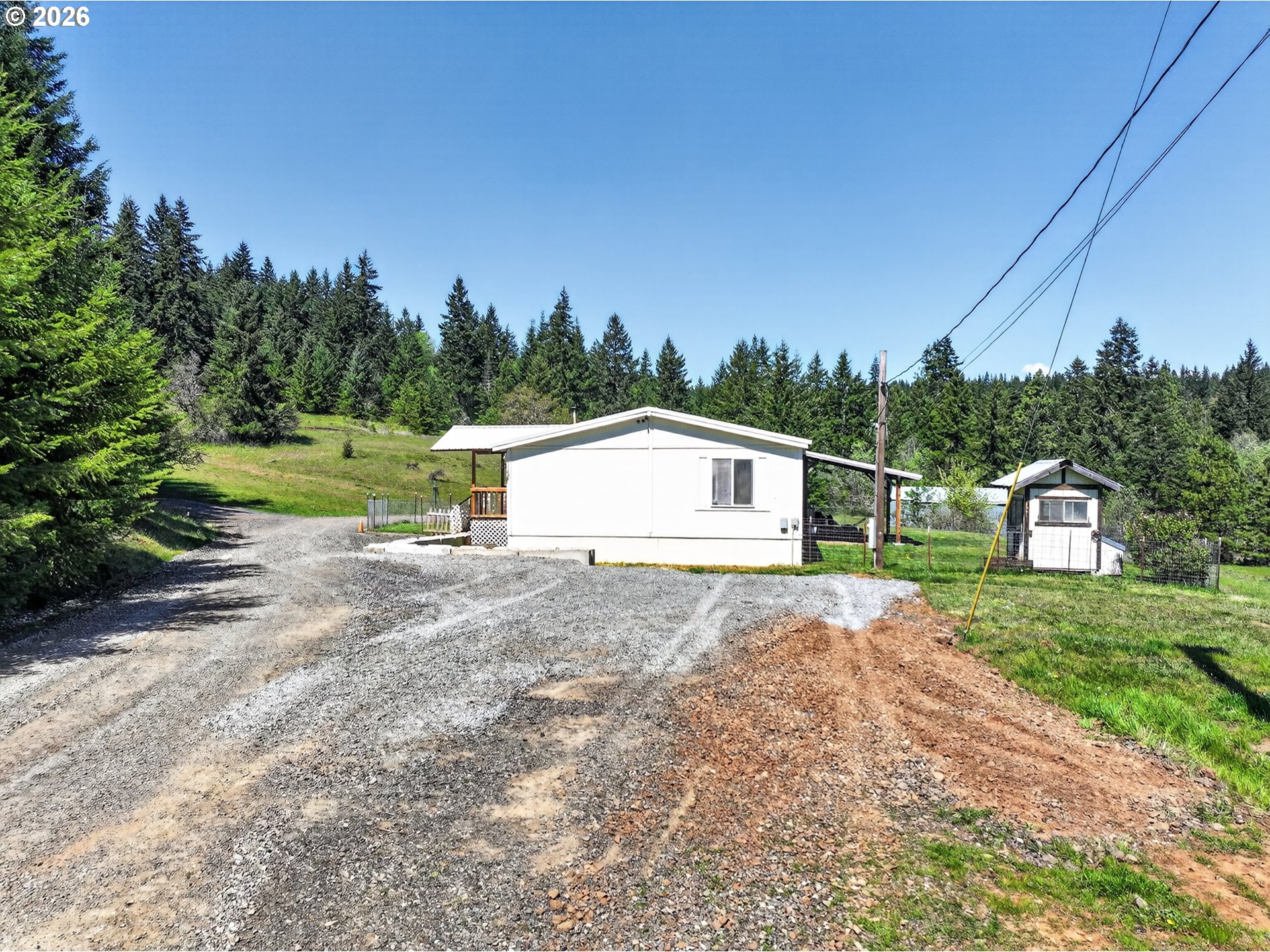 97 Kida Road White Salmon, WA 98672 - Photo 20 of 45 a house with trees in front of it