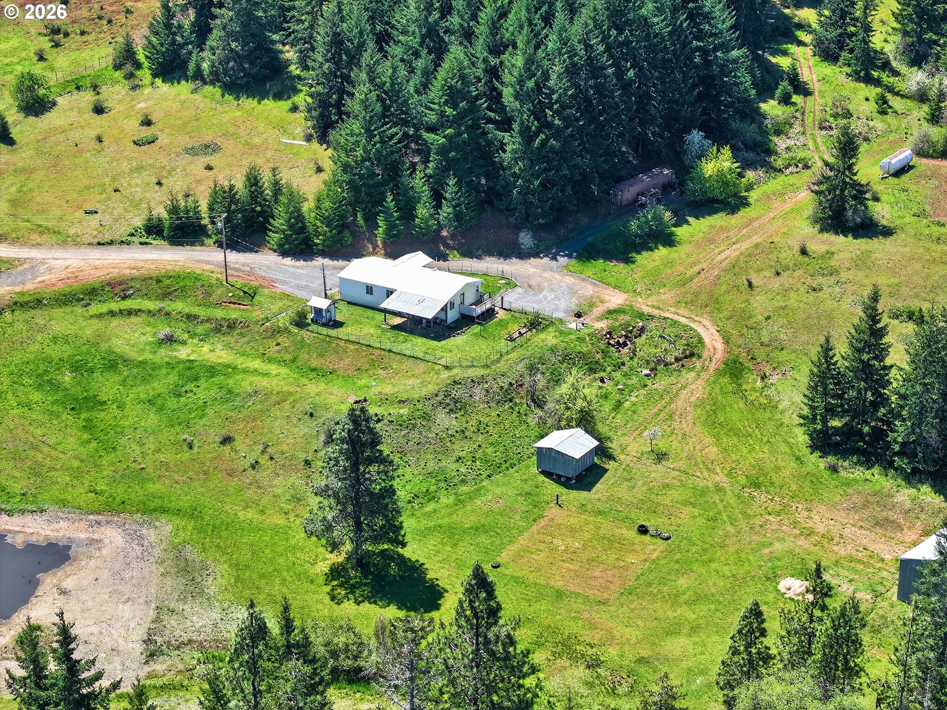 97 Kida Road White Salmon, WA 98672 - Photo 2 of 45 a backyard of a house with lots of green space
