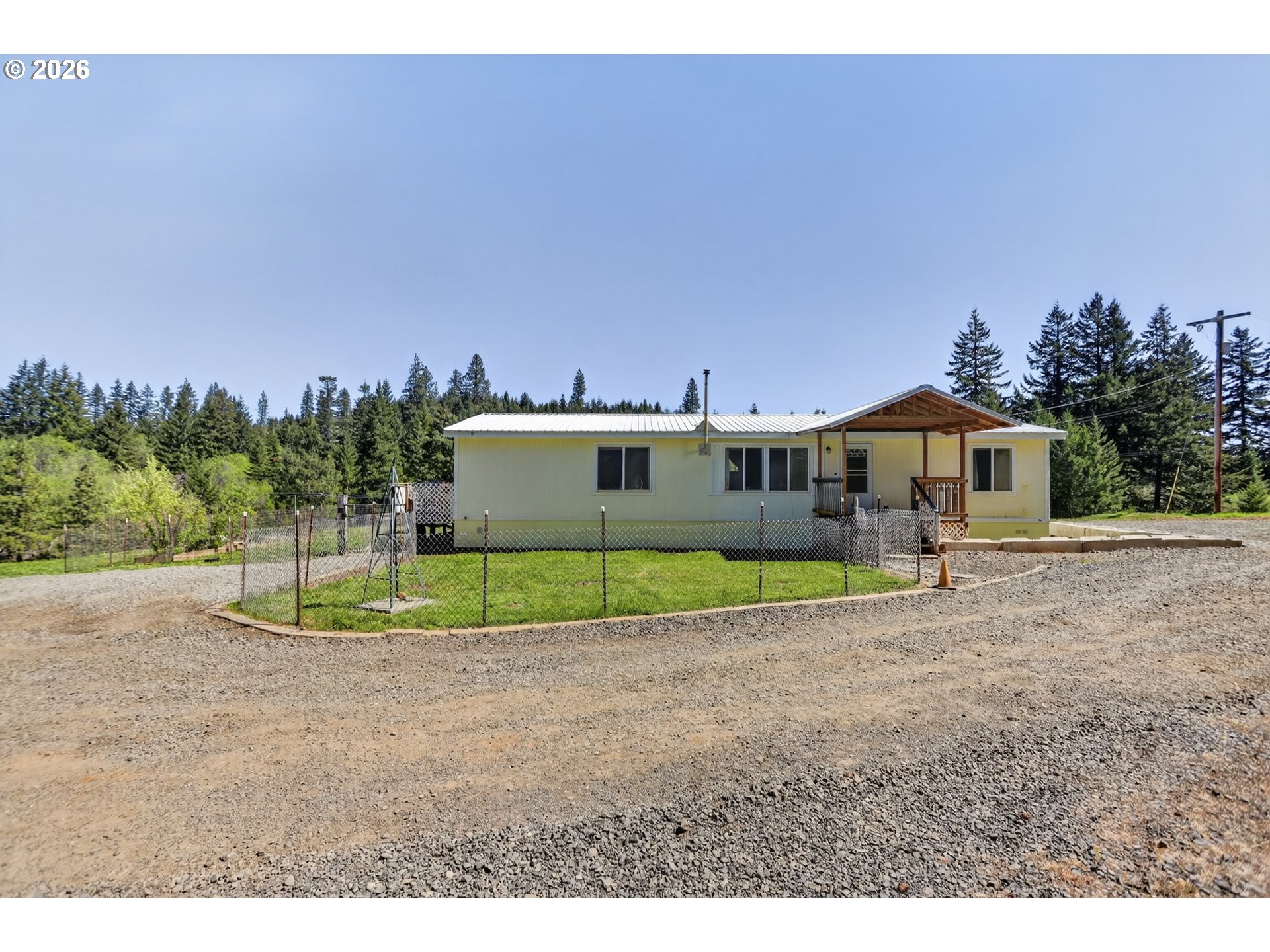 97 Kida Road White Salmon, WA 98672 - Photo 24 of 45 a view of a house with a backyard and a garage