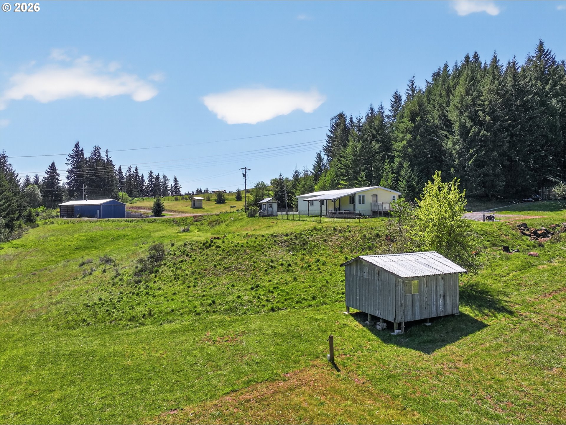 97 Kida Road White Salmon, WA 98672 - Photo 3 of 45 a view of a backyard with plants and a garden