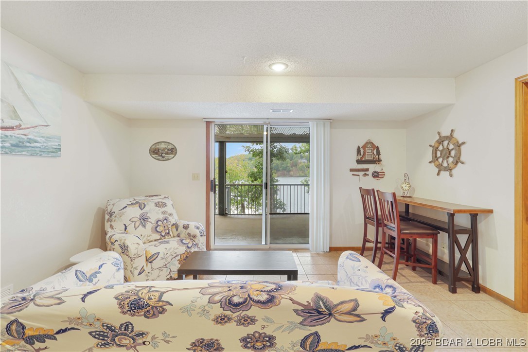 30895 Berry Road Stover, MO 65078 - Photo 25 of 47 Lower level Family room w access to the screen por