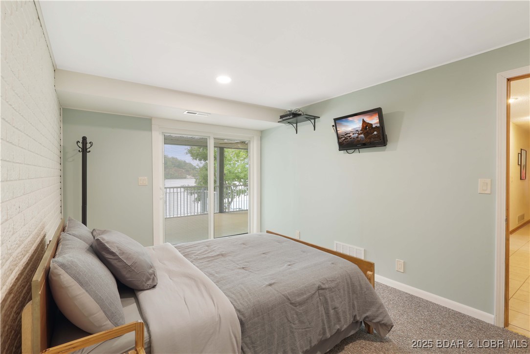 30895 Berry Road Stover, MO 65078 - Photo 29 of 47 Fourth bedroom, New slider access to screened porc