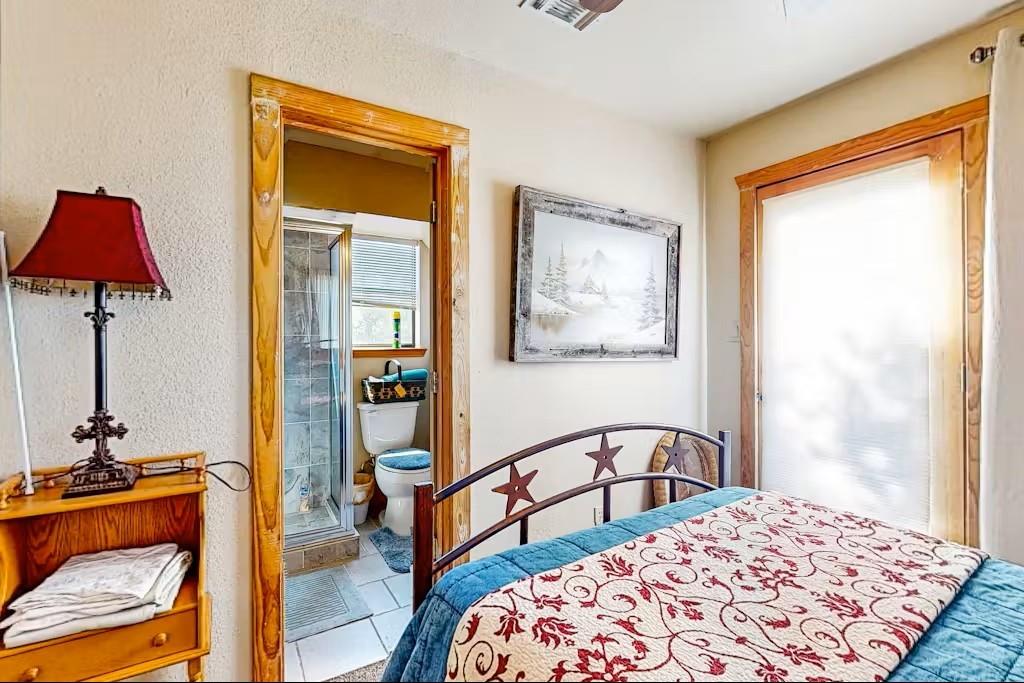 120 Live Oak Road Whitney, TX 76692 - Photo 16 of 21 a bedroom with a bed and a window