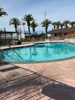 a stove top oven sitting inside of a kitchen