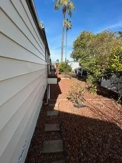 a view of a backyard of the house