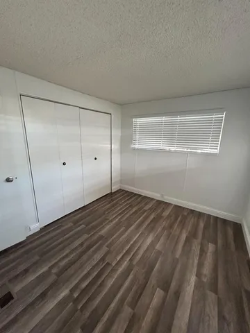 a kitchen with stainless steel appliances granite countertop a refrigerator sink and cabinets
