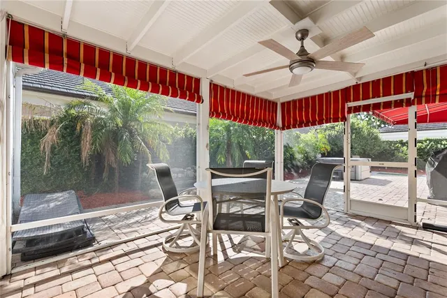 a view of a dining room with furniture wooden floor and garden view