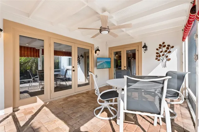 a view of a dining room with furniture wooden floor and chandelier