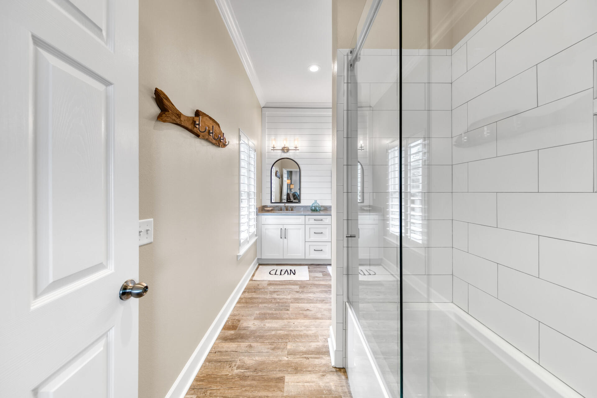 1537 Driftwood Point Road Santa Rosa Beach, FL 32459 - Photo 61 of 77 a bathroom with a glass shower door and mirror