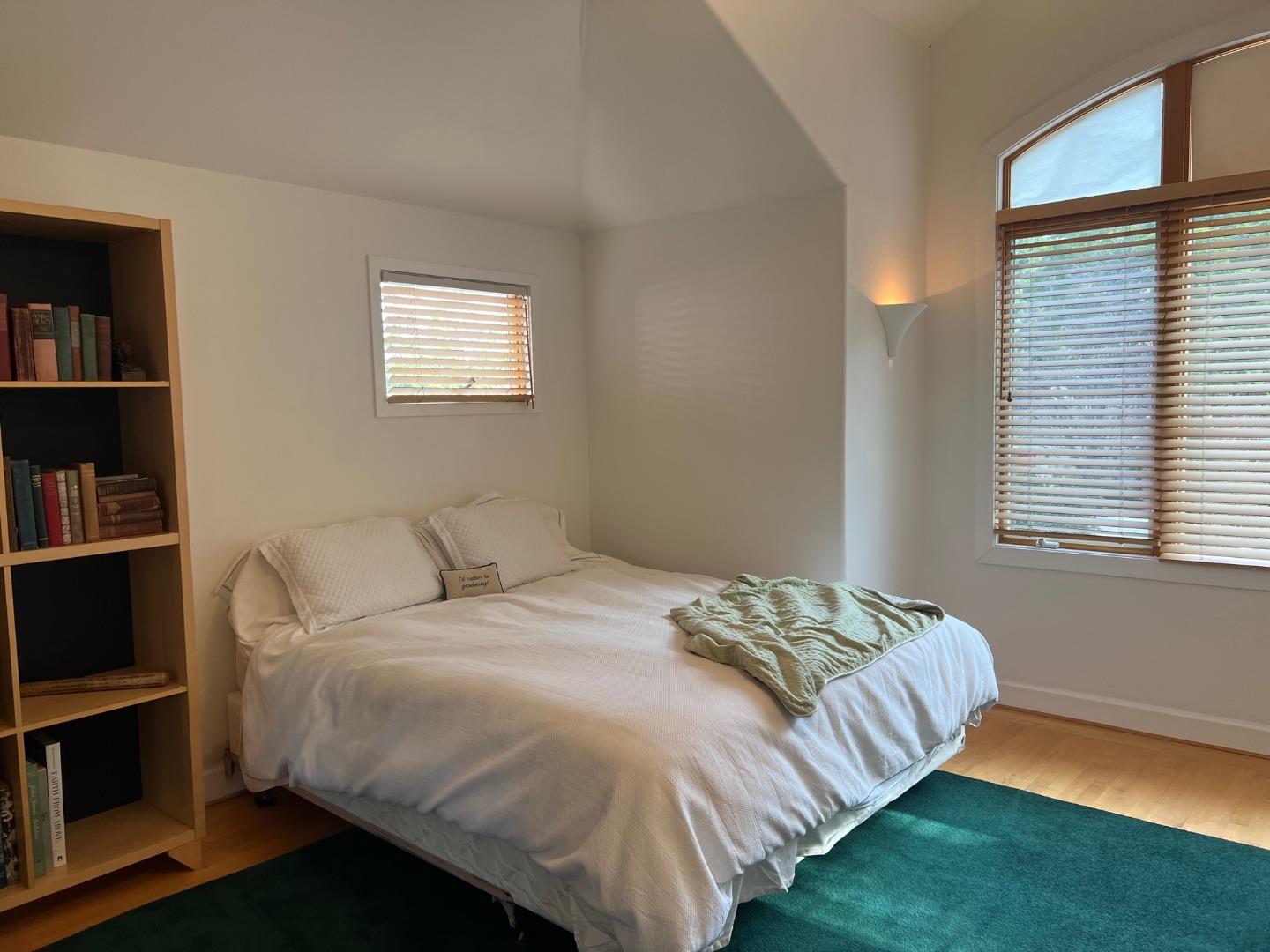 2198 Avy Avenue Menlo Park, CA 94025 - Photo 23 of 39 a bedroom with a bed and a book shelf