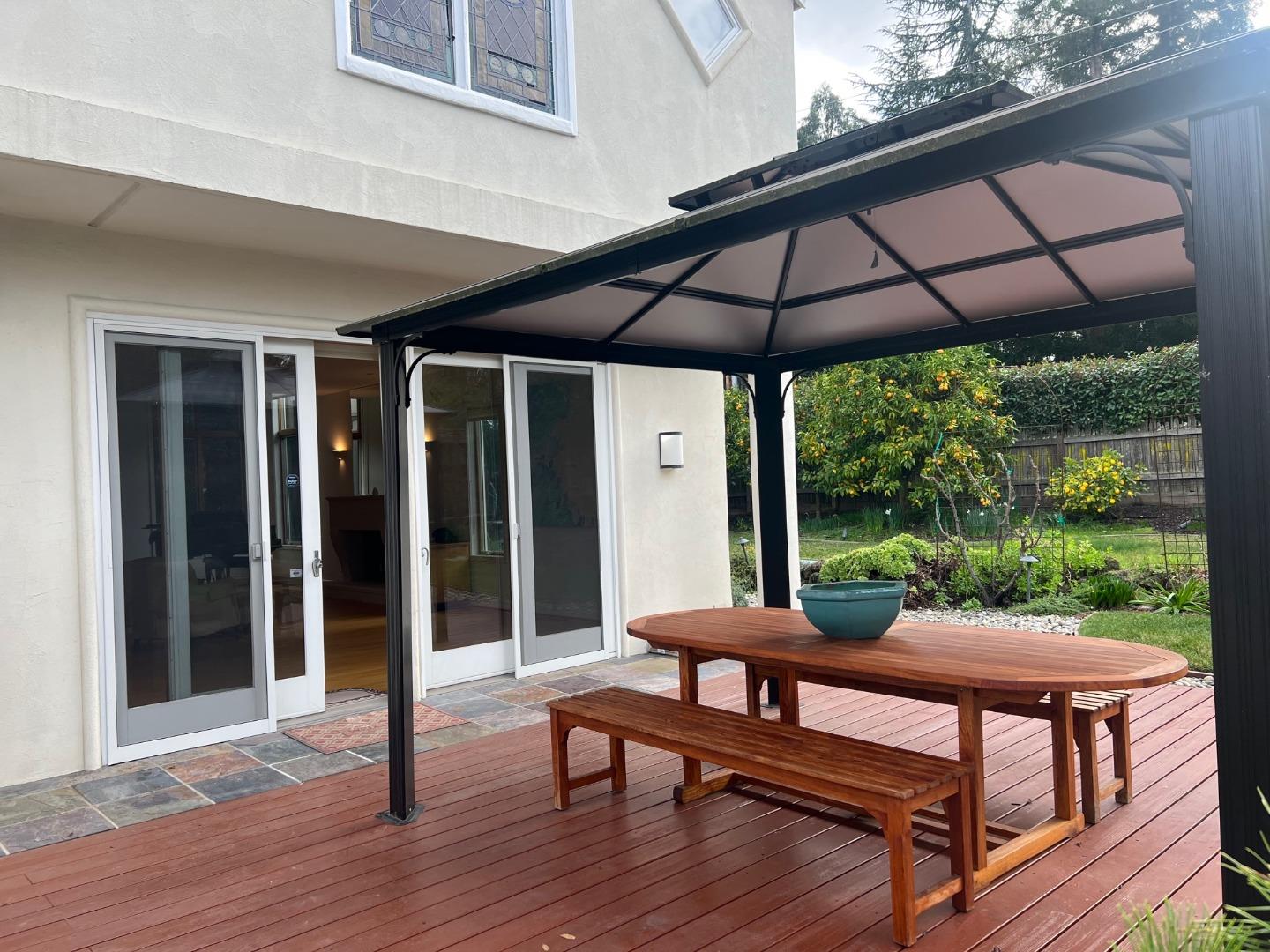 2198 Avy Avenue Menlo Park, CA 94025 - Photo 30 of 39 a patio with lawn chairs and wooden floor