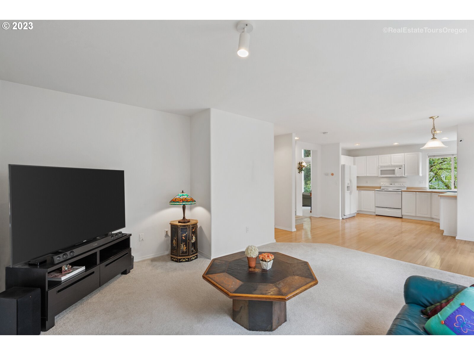 14345 Holly Springs Road Lake Oswego, OR 97035 - Photo 12 of 32 a living room with furniture and a flat screen tv