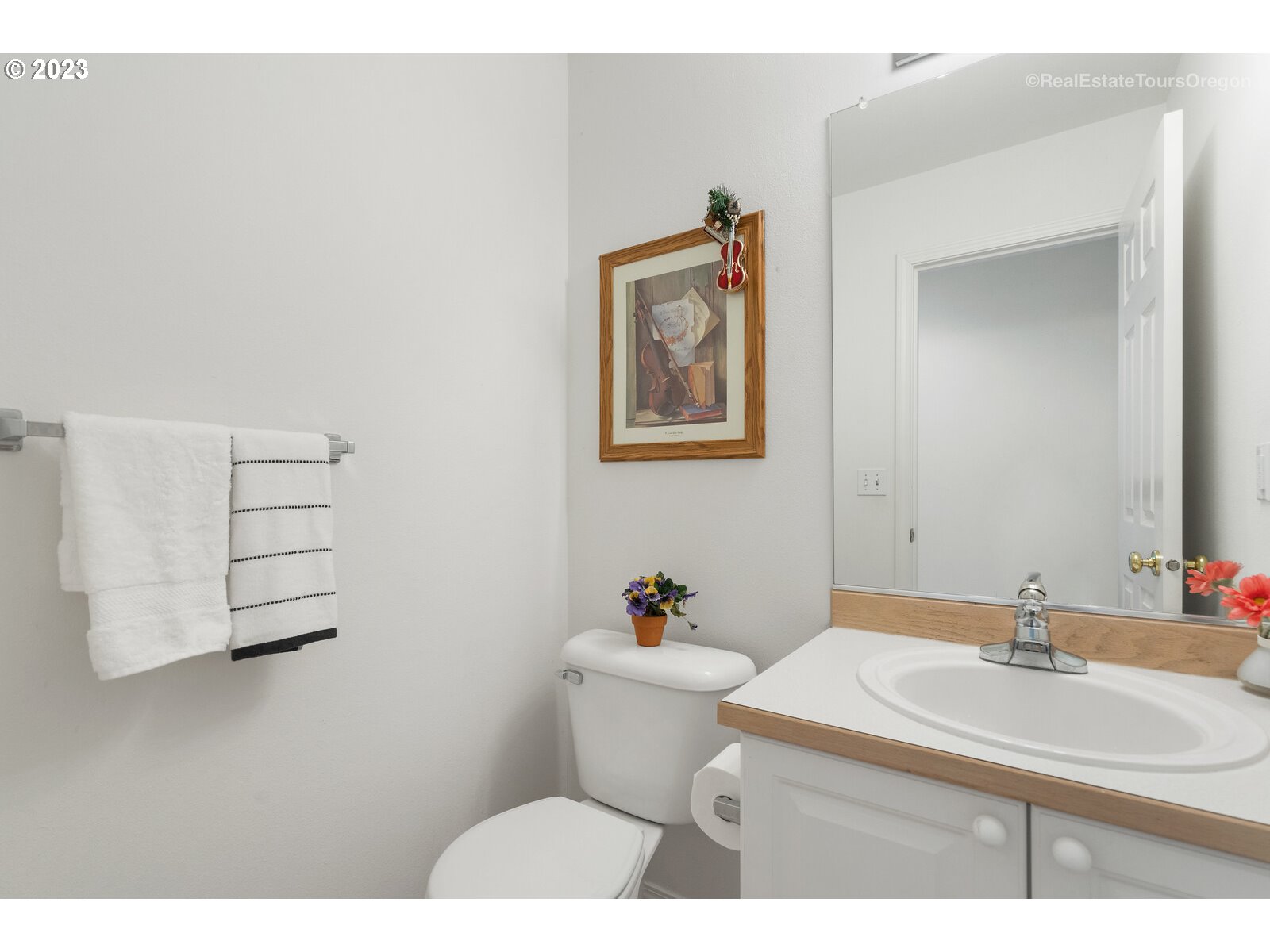 14345 Holly Springs Road Lake Oswego, OR 97035 - Photo 13 of 32 a bathroom with a sink mirror and toilet