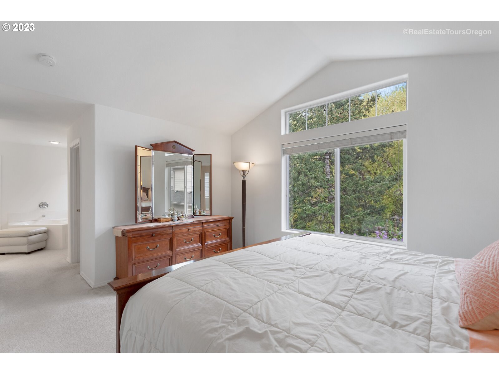 14345 Holly Springs Road Lake Oswego, OR 97035 - Photo 15 of 32 a bedroom with a bed and window