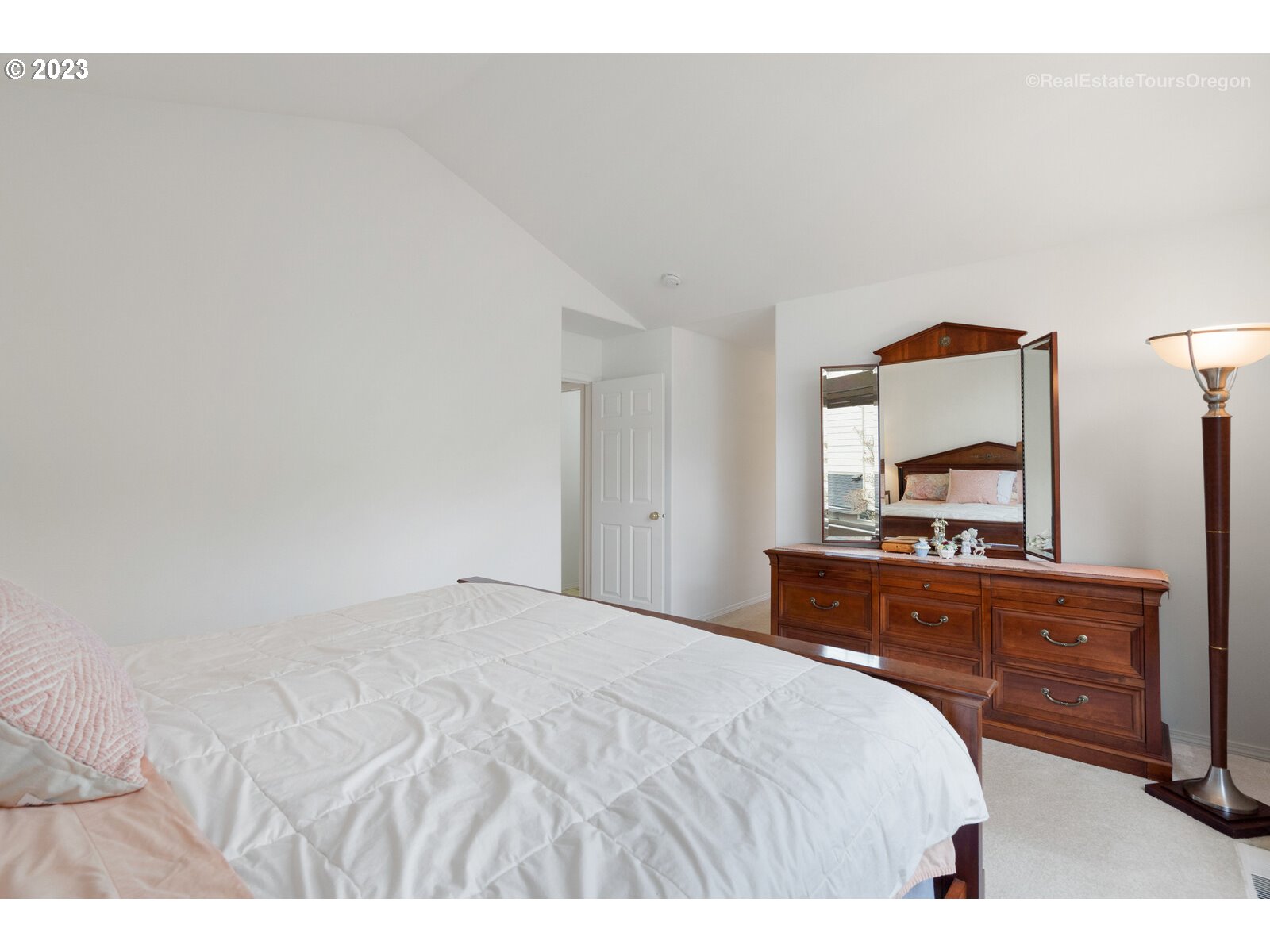 14345 Holly Springs Road Lake Oswego, OR 97035 - Photo 16 of 32 a bedroom with a bed and a dresser