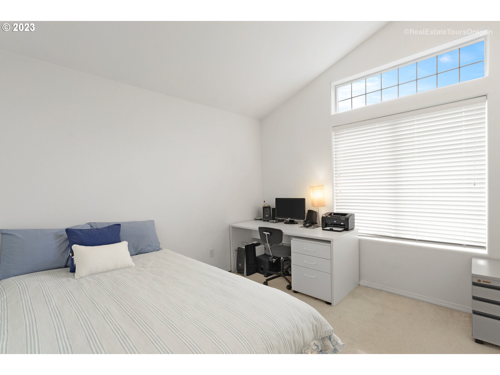 14345 Holly Springs Road Lake Oswego, OR 97035 - Photo 21 of 32 a bedroom with a bed and a window