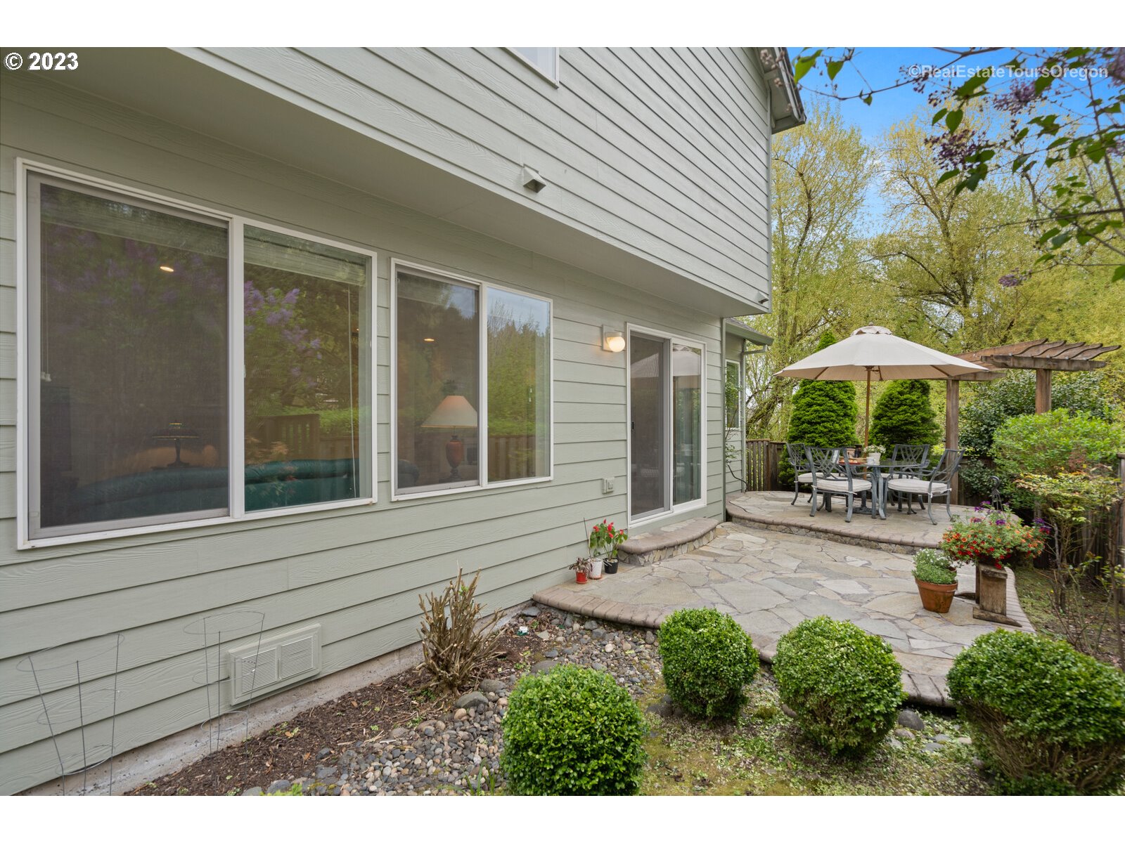 14345 Holly Springs Road Lake Oswego, OR 97035 - Photo 32 of 32 a view of a house with backyard and sitting area