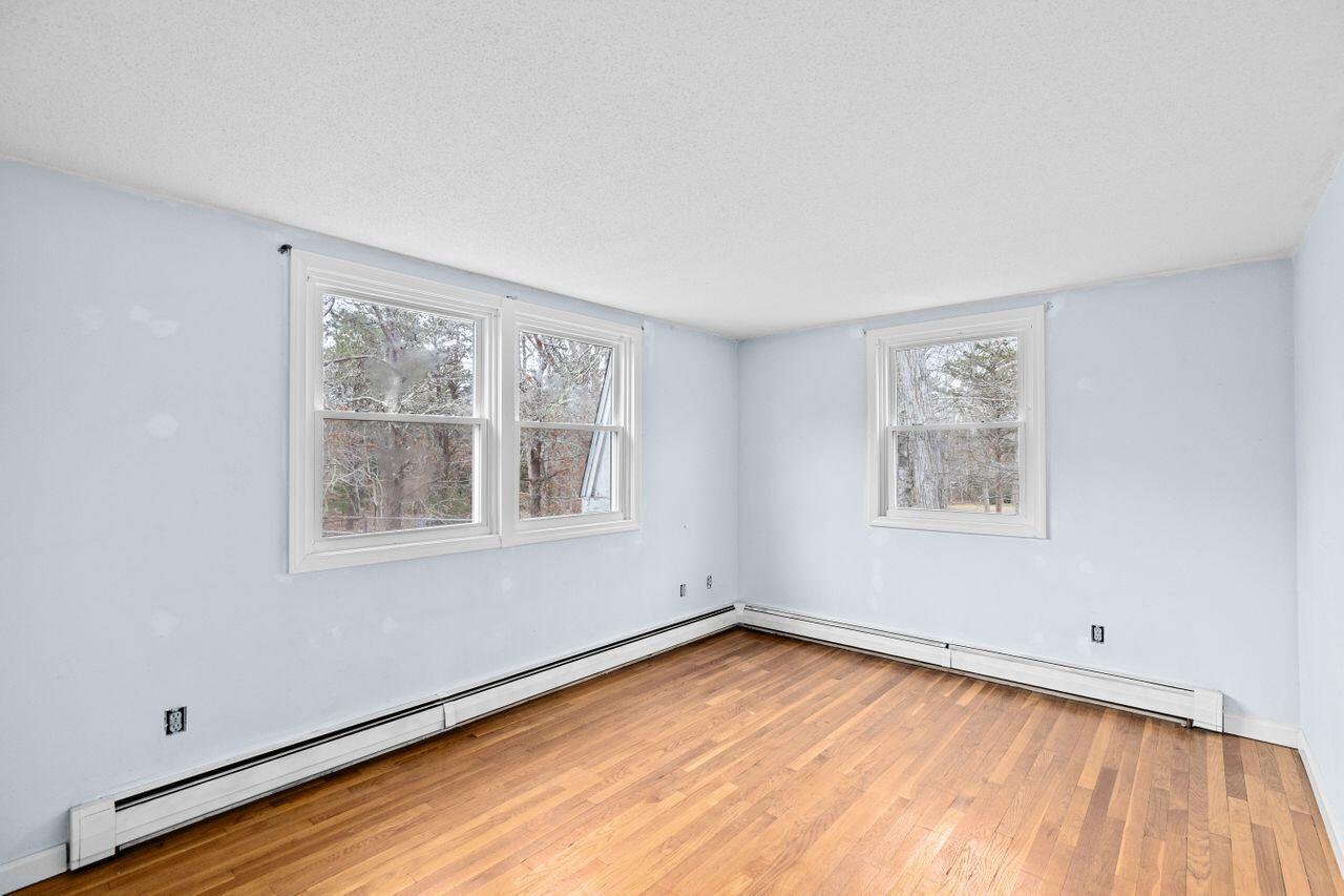 1460 Massasoit Road Eastham, MA 02642 - Photo 15 of 42 a view of a room with wooden floor and window