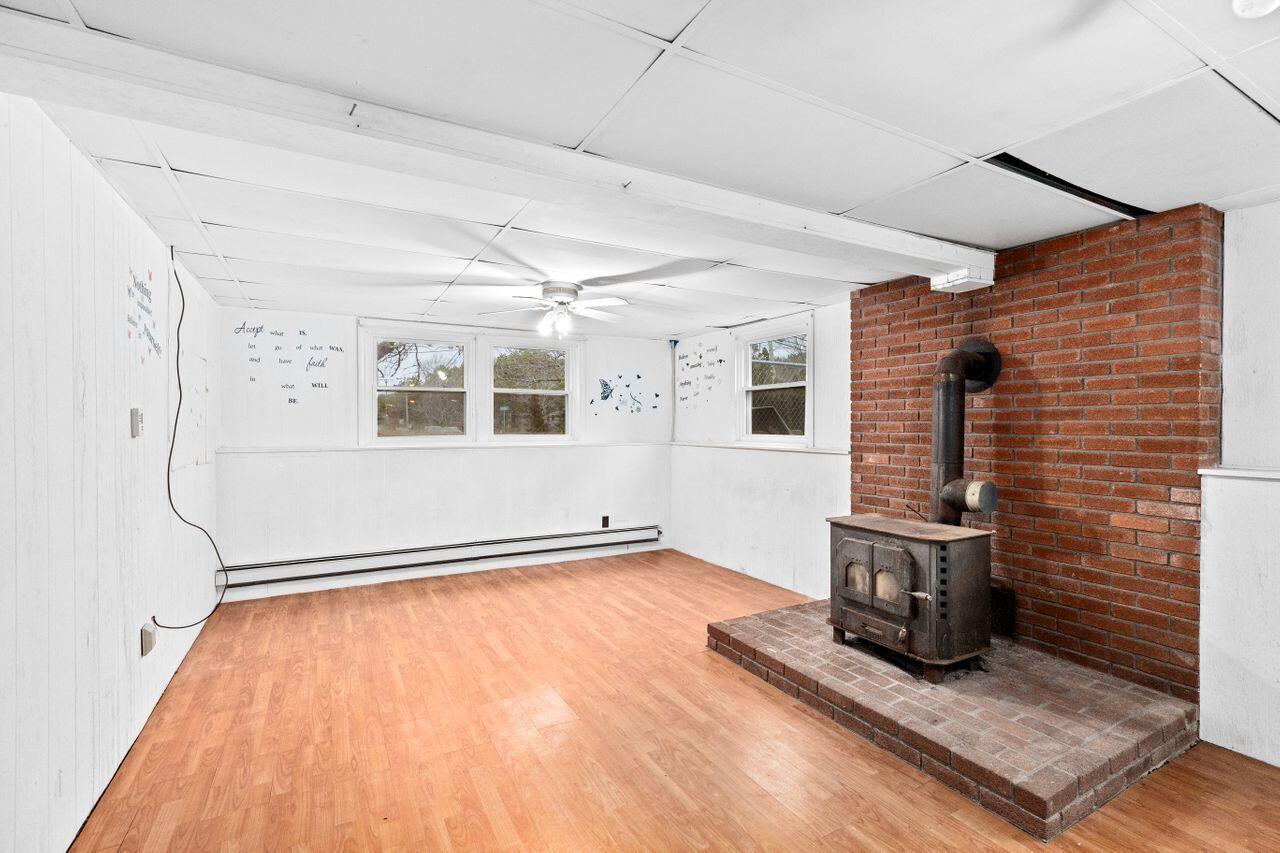 1460 Massasoit Road Eastham, MA 02642 - Photo 24 of 42 a view of empty room with wooden floor and fan