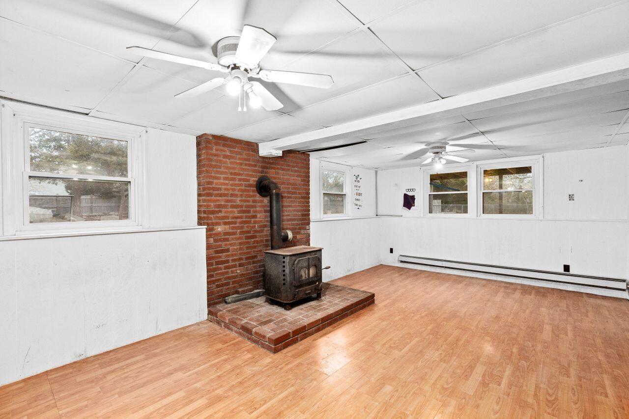 1460 Massasoit Road Eastham, MA 02642 - Photo 25 of 42 a view of an empty room with a window