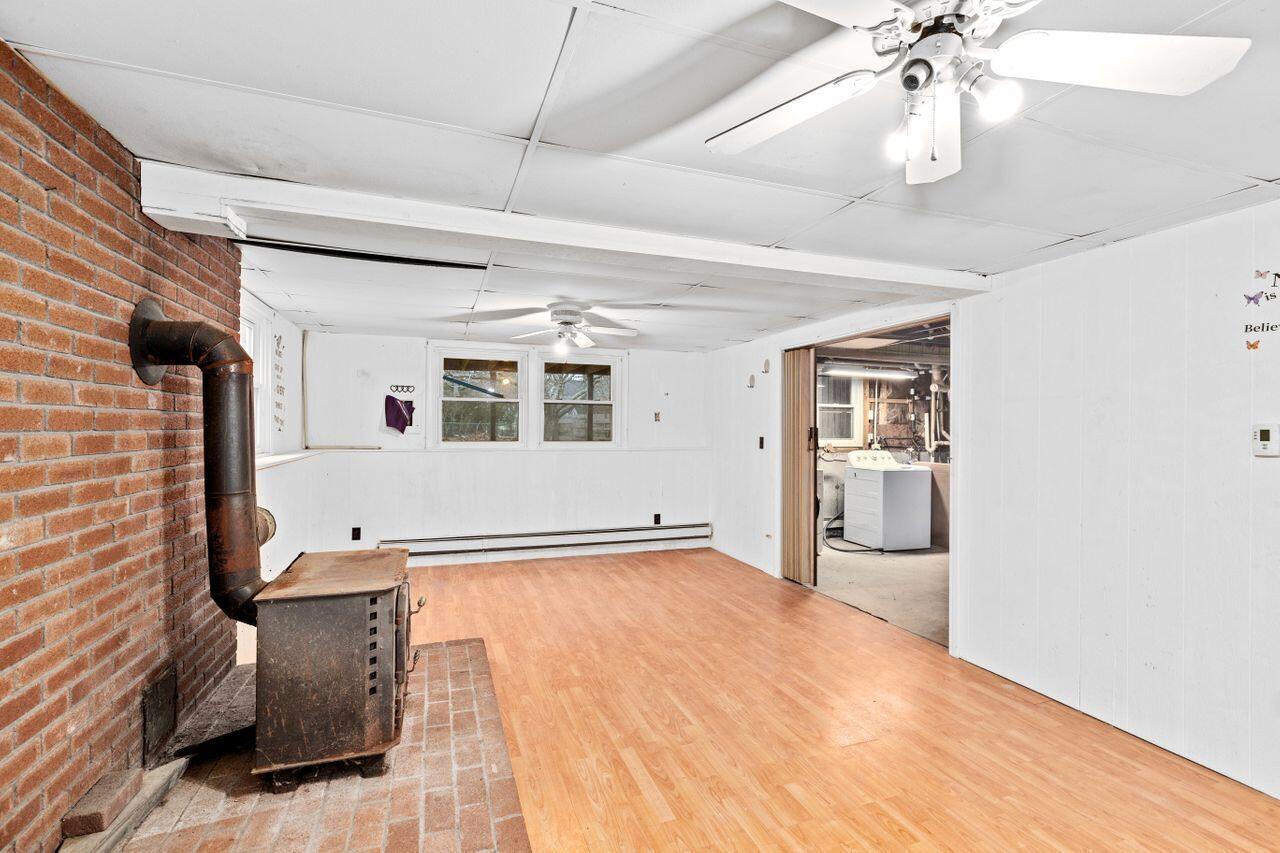 1460 Massasoit Road Eastham, MA 02642 - Photo 26 of 42 a view of empty room with wooden floor and fan