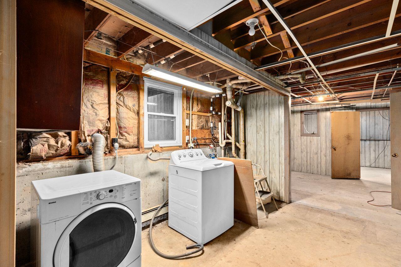 1460 Massasoit Road Eastham, MA 02642 - Photo 27 of 42 a view of a storage & utility room with washer and dryer