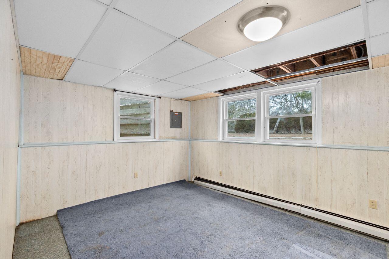 1460 Massasoit Road Eastham, MA 02642 - Photo 32 of 42 a view of an empty room with a window