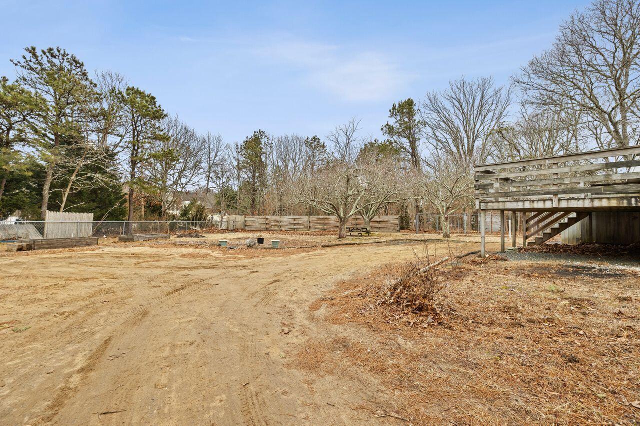 1460 Massasoit Road Eastham, MA 02642 - Photo 37 of 42 a view of yard covered with snow