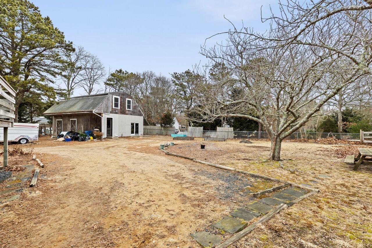 1460 Massasoit Road Eastham, MA 02642 - Photo 38 of 42 a front view of a building with snow on the road